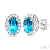 5x3 MM Oval Shape Blue Topaz and 1/8 Ctw Round Cut Diamond Halo Semi-Precious Stud Earrings in 10K White Gold