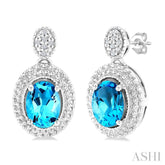 7X5 MM Oval Cut Blue Topaz and 1/20 Ctw Round Cut Diamond Semi-Precious Earrings in Sterling Silver