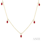 5x3 MM Oval Shape Ruby and 1/8 Ctw Round Cut Diamonds Precious Station Necklace in 10K Yellow Gold