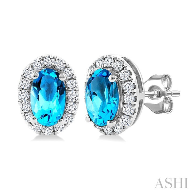 5x3 MM Oval Shape Blue Topaz and 1/8 Ctw Round Cut Diamond Halo Semi-Precious Stud Earrings in 14K White Gold