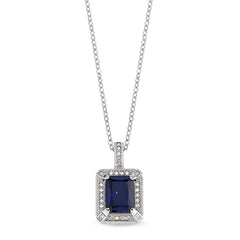 Platinum finish sterling micropave emerald cut synthetic blue corrundum pendant with simulated diamonds on an 18 cable chain