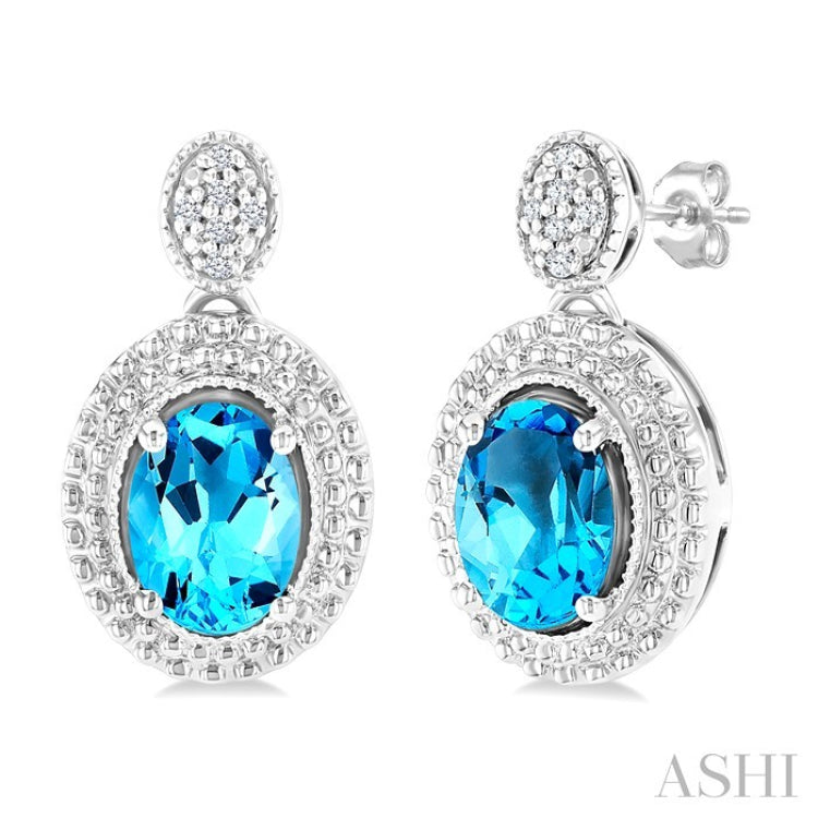 7X5 MM Oval Cut Blue Topaz and 1/20 Ctw Round Cut Diamond Semi-Precious Earrings in Sterling Silver
