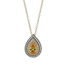 Gold and gold vermeil finish sterling silver pendant with a canary colored stone and simulated diamonds on 18 chain