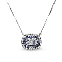 Gold vermeil and black rhodium finish sterling silver pendant with synthetic blue sapphire and simulated diamonds on 18 cabl