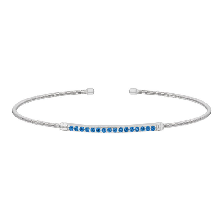 Rhodium finish sterling silver cable cuff bracelet with simulated blue zircon birth gems - december