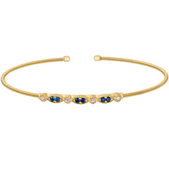 Gold finish sterling silver cable cuff bracelet with simulated blue sapphire and simulated diamond marquis & round design