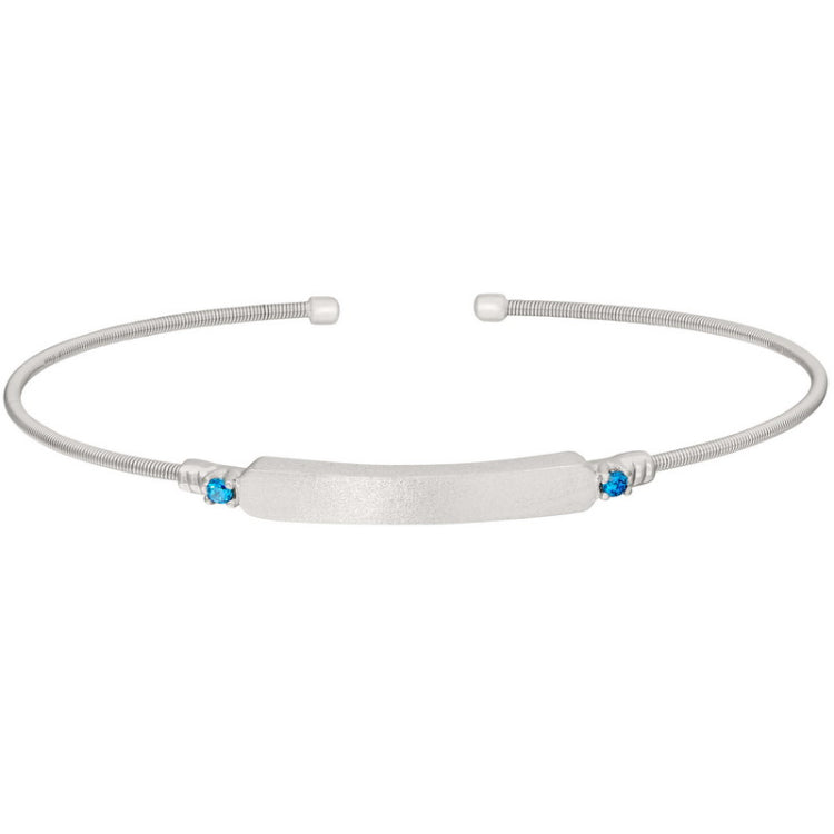 Rhodium finish sterling silver cable cuff bracelet with name plate and simulated blue zircon birth gems - december