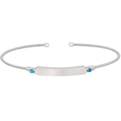 Rhodium finish sterling silver cable cuff bracelet with name plate and simulated blue zircon birth gems - december