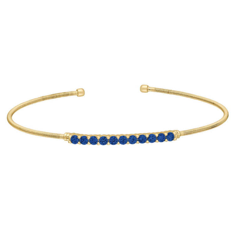 Gold finish sterling silver cable cuff bracelet with simulated sapphires