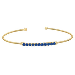 Gold finish sterling silver cable cuff bracelet with simulated sapphires