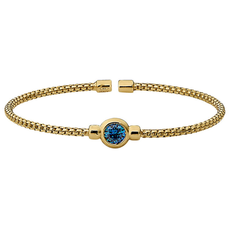 Gold finish sterling silver rounded box link cuff bracelet with bezel set simulated blue topaz birth gem