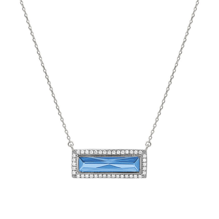 Rhodium finish sterling silver necklace with rectangular simulated blue topaz stone and simulated diamonds on 16 - 18 chain