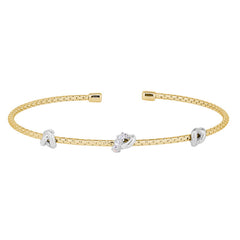 Gold finish sterling silver corean cable bracelet with 3 rhodium finish knots with simulated diamonds on the center knot