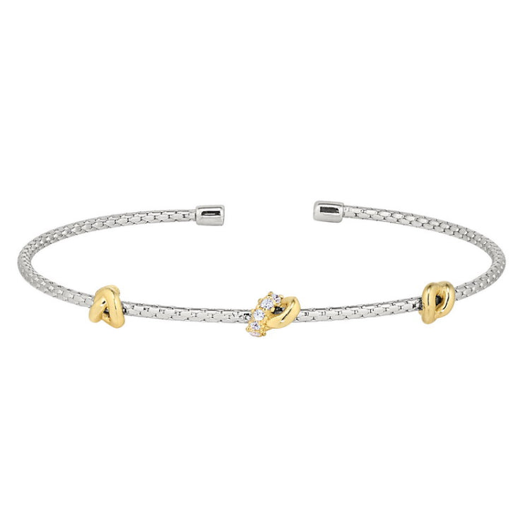 Rhodium finish sterling silver corean cable cuff bracelet with 3 gold finish knots with simulated diamonds on the center kno