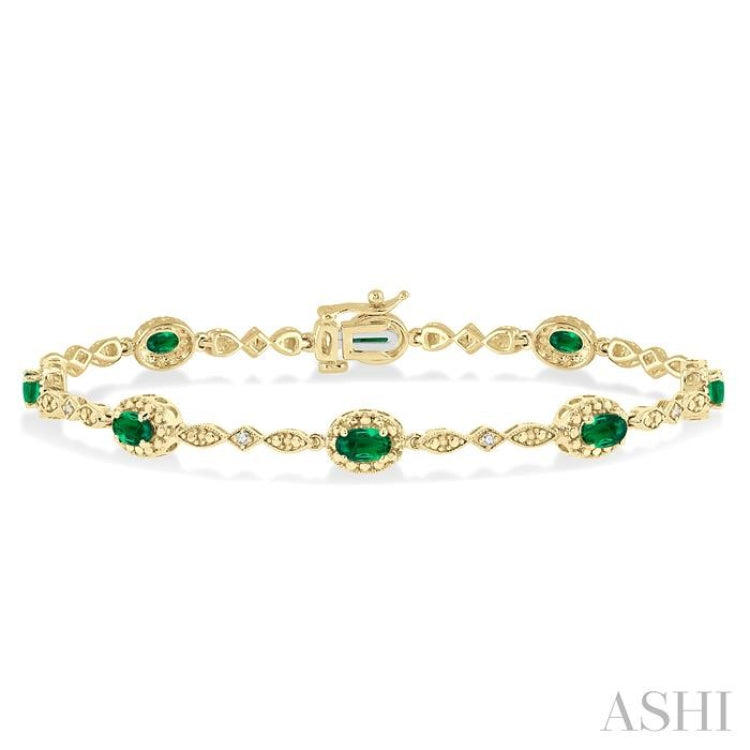 5x3 MM Oval Cut Emerald and 1/20 Ctw Single Cut Diamond Bracelet in 10K Yellow Gold
