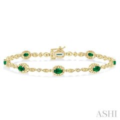5x3 MM Oval Cut Emerald and 1/20 Ctw Single Cut Diamond Bracelet in 10K Yellow Gold