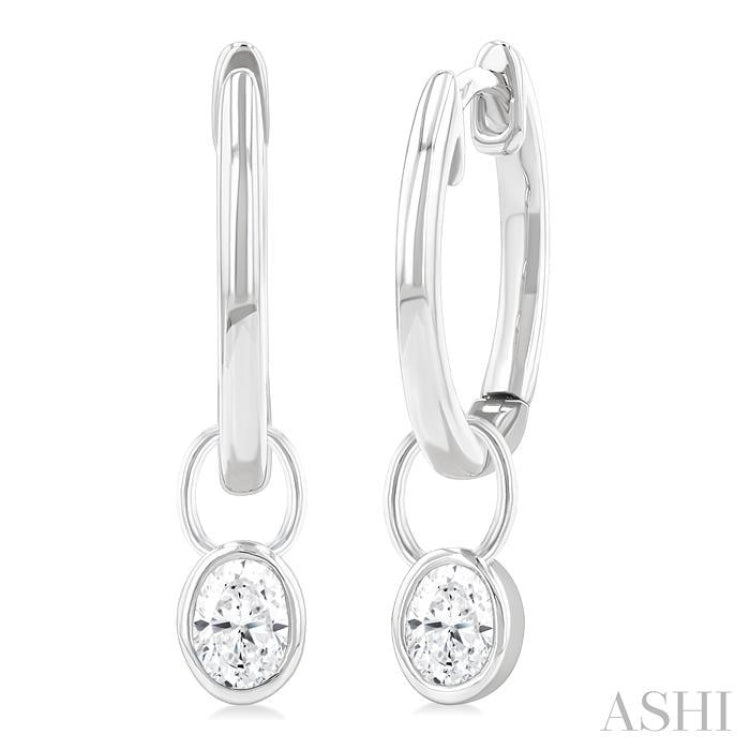 1/3 Ctw Bezel Set Oval Cut Diamond Huggie Earrings in 10K White Gold